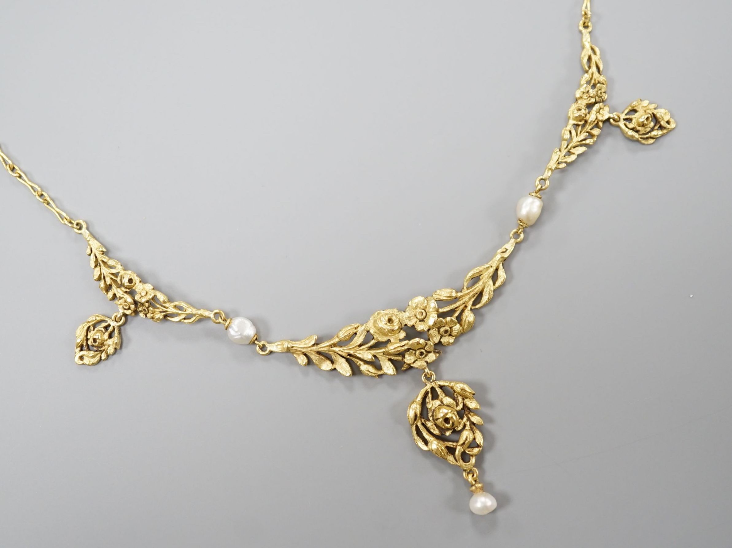 An early 20thcentury French yellow metal (18ct poincon mark) and baroque pearl set drop pendant necklace, 40cm, gross weight 8.1 grams